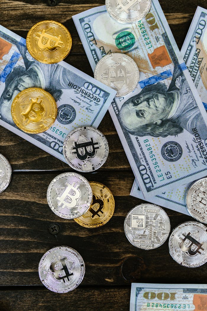 Colorful mix of bitcoins and US dollar bills, showcasing cryptocurrency and finance investment.
